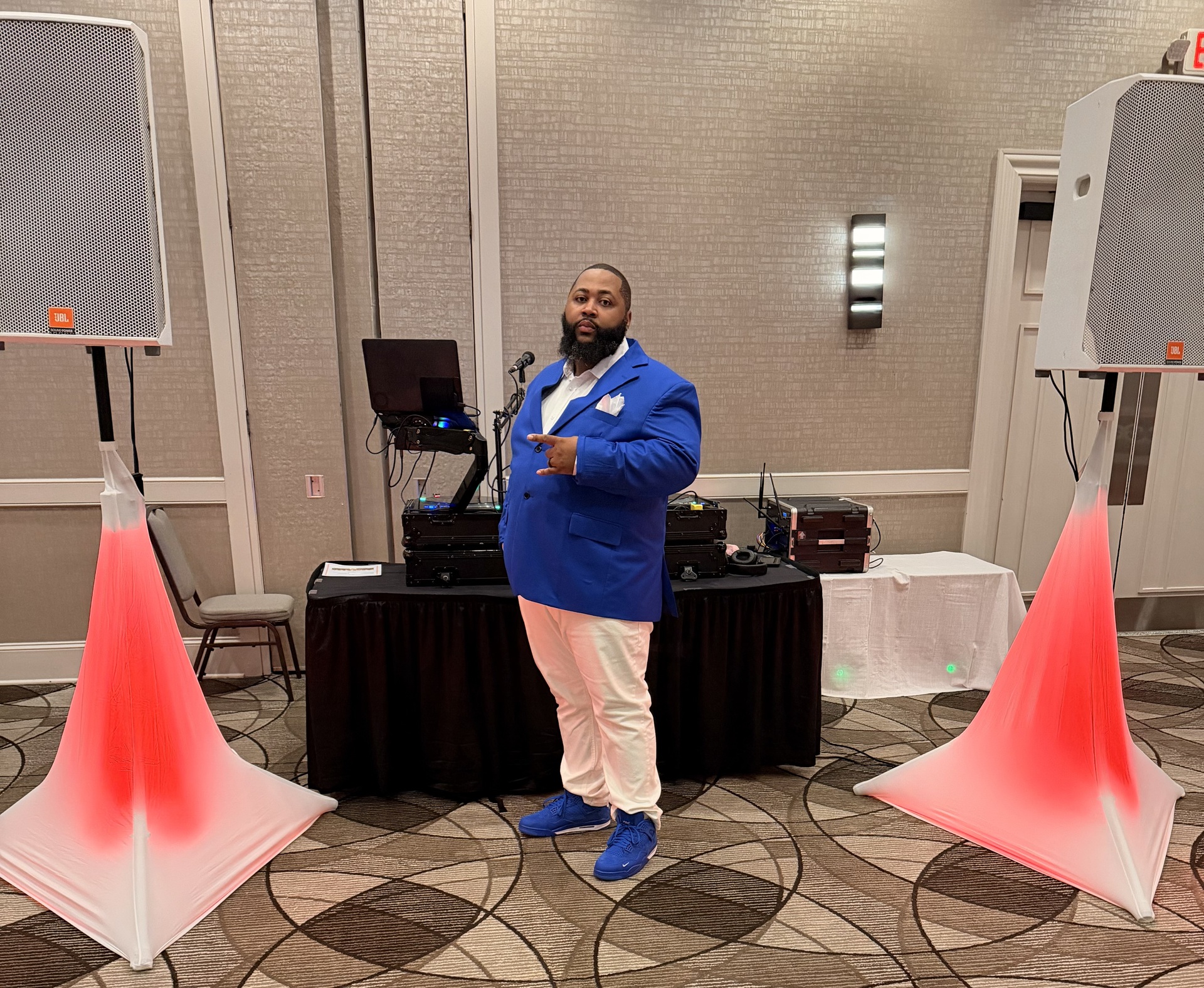 Frequency One DJ setup with white speakers