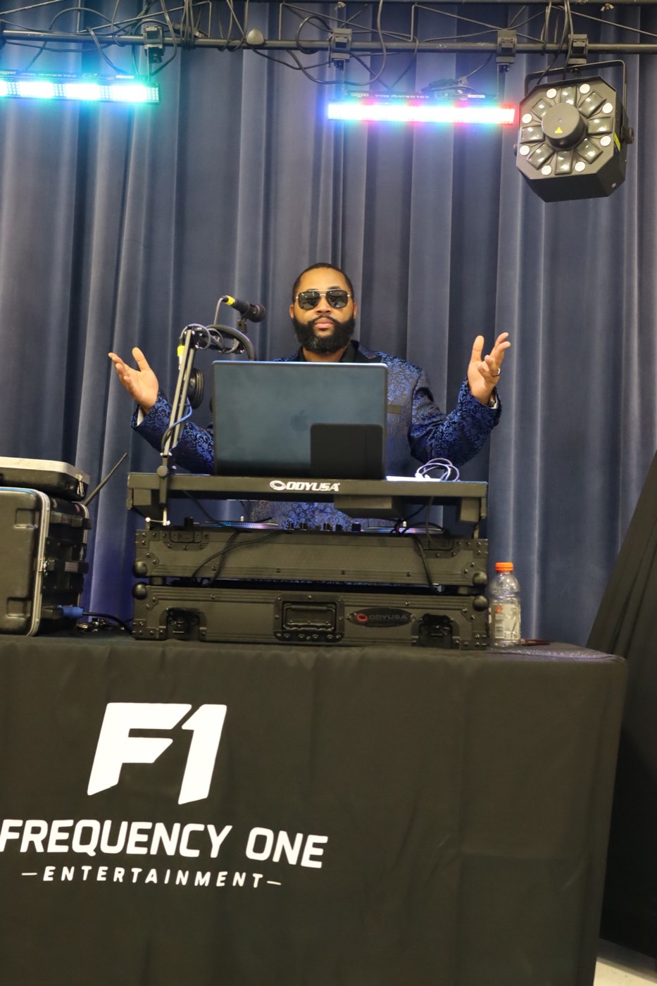Frequency One DJ behind the booth at a recent event